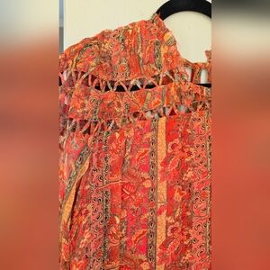 Anthropologie Let Me Be Talitha blouse with an orange, green, and gold floral